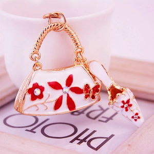 Golden flower rhinestone high heel and handbag keychain charm set with red floral accents