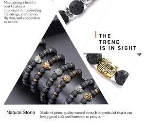 Macro detail of lava stone energy bracelets with gold and silver lion and buddha heads