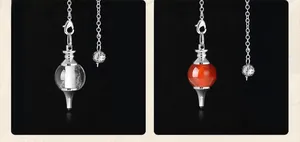 Detail of round crystal and agate stone pendulum pendants with silver-plated chains