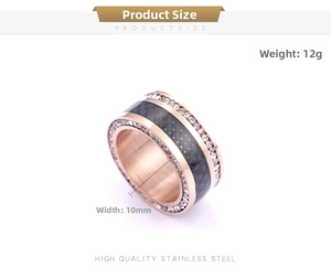 Detail view of a 10mm rose gold stainless steel ring with carbon fiber and cz stones
