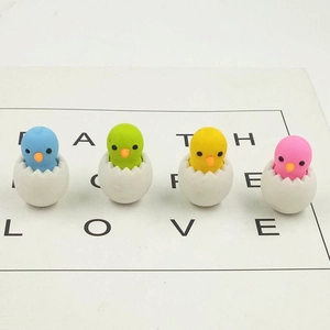 Set of four cute cartoon chick erasers in colorful eggshells for student stationery