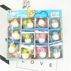 Close-up of cute cartoon chick in eggshell shaped erasers in assorted bright colors