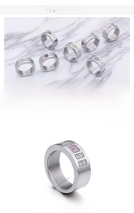 Detail of colorful square zircon stones set in polished stainless steel ring bands