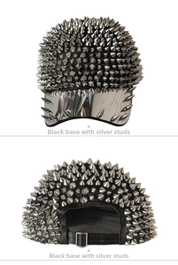 Close-up of black punk baseball cap with silver metal spikes and adjustable strap