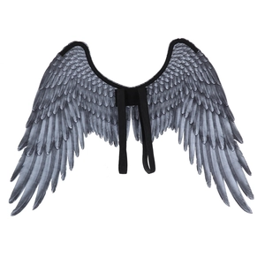 Detail of grey-black feather wings with elastic shoulder straps for costume cosplay