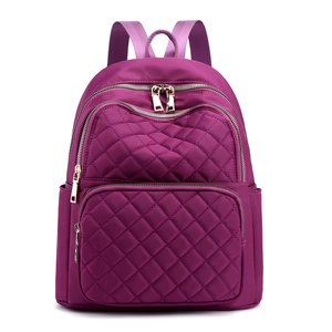 Fashionable purple quilted nylon backpack for women featuring durable metal zippers