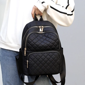 Fashion black nylon backpack for women with diamond quilted pattern and metal zippers