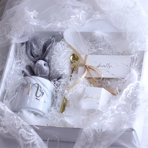 Elegant gift box with Mr ceramic mug, grey plush bunny, golden spoon and paper filler
