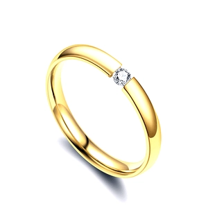 Minimalist golden open ring for couples featuring a central sparkling cubic zirconia stone