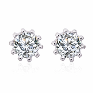 Macro shot of silver stud earrings with brilliant-cut round cubic zirconia and claw setting