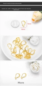 Detail of gold-plated earring hooks showing 10x15mm dimensions next to a coin