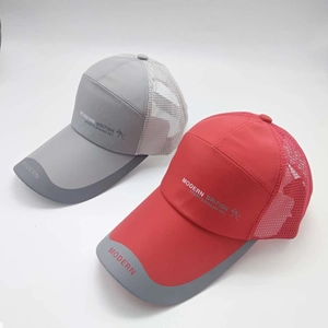 Detail view of breathable mesh panels and side lettering on grey and red baseball caps