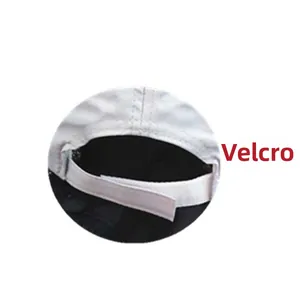 Detailed view of the adjustable white mesh baseball cap with secure velcro closure