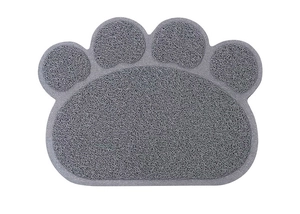 Close-up of gray paw-shaped cat litter mat with non-slip PVC loop fiber texture