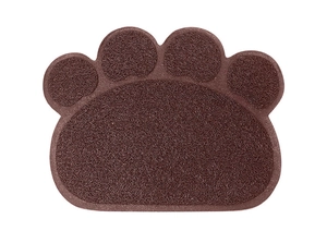 Detailed view of dark brown paw-shaped PVC litter mat with anti-slip mesh texture