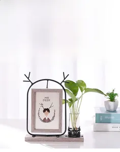 Black iron deer frame with glass hydroponic vase and wooden base for 4x6 photos