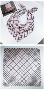 Pink silk-like square scarf featuring elegant black and red diamond grid patterns
