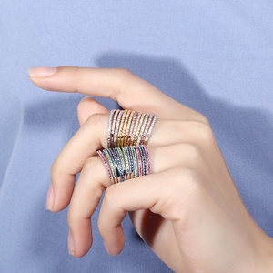 Close-up of sparkling multi-color AAA cubic zirconia gold plated stackable rings