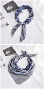 Close-up of elegant blue polka dot silk scarf with silver-grey satin patchwork