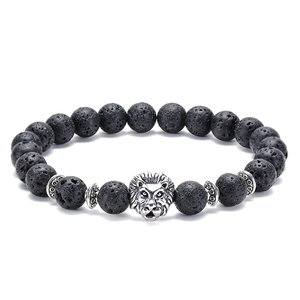 Detailed view of natural lava stone beads and antique silver lion head on beaded bracelet
