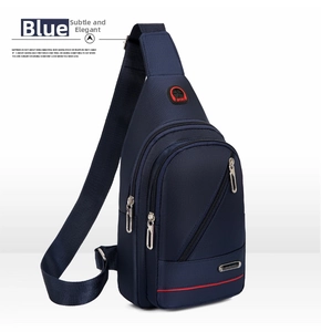 Detail view of the durable navy blue waterproof oxford chest bag with red accents