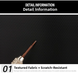 Detail shot of scratch-resistant black oxford fabric being tested with a sharp metal tool