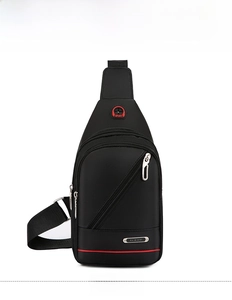Close-up of black waterproof nylon crossbody bag featuring multi-zippered compartments