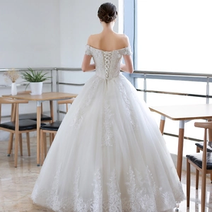 Elegant off-shoulder ball gown wedding dress with lace embroidery and lace-up back