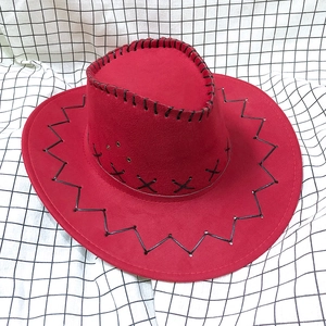 Detailed top view of red cowboy hat with stitch decor and side ventilation holes