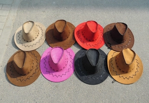 Detail view of eight colorful faux suede cowboy hats with decorative cross stitching