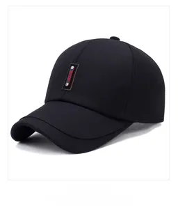 Close-up of black cotton baseball cap with leather SPORT patch and metal rivets