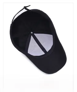 Detail of black cotton baseball cap interior featuring white stiff lining and metal buckle