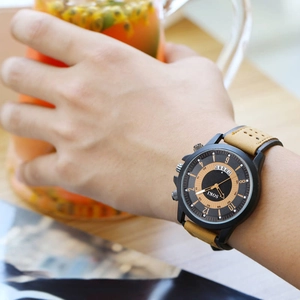 SOKI men's military sport quartz watch with black dial and brown leather strap on wrist