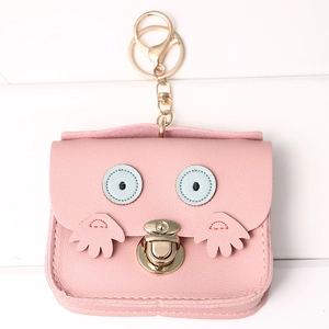 Detailed close-up of pink PU leather owl coin purse with gold zipper and keychain