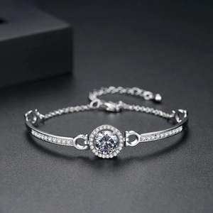 Silver bracelet featuring a micro-paved zircon disc and adjustable extender chain