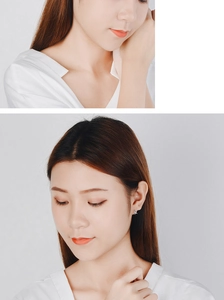 Macro close-up showing star-shaped silver stud earrings worn on the ear for a refined look