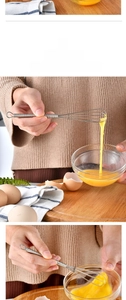 Detail of a mini stainless steel coil whisk with spring handle and a convenient hanging loop
