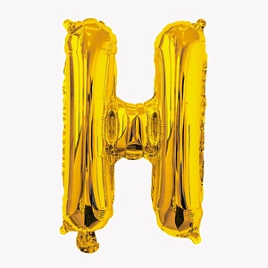 Close-up of a 32-inch golden letter H foil balloon with glossy metallic finish