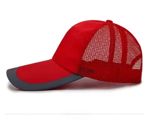 Side view of red breathable mesh baseball cap with sport logo and long curved visor