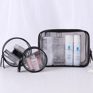 Three-piece set of transparent PVC travel toiletry bags with black zipper trim
