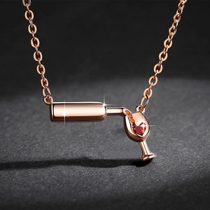 Rose gold wine bottle and glass pendant necklace with red heart zircon in starry light