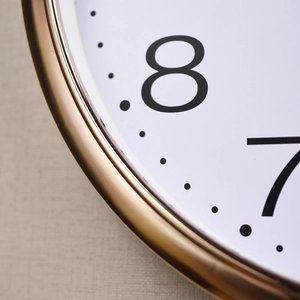 12-inch modern wall clock with brushed gold frame and minimalist white numeral dial