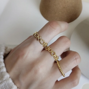 Elegantly layered 925 sterling silver twist ring and geometric link chain ring in gold