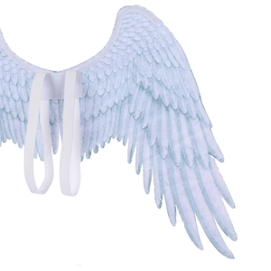 Close-up of white angel wings showing feather textures and elastic straps for children