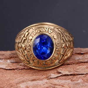 Close-up of US Army vintage titanium steel ring with blue stone on rustic wood