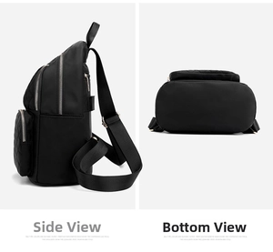 Detail view of black nylon backpack showing side pocket and quilted bottom base