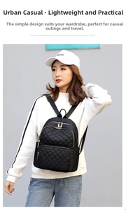 Close-up of black quilted nylon backpack featuring multi-pocket design and zip closure
