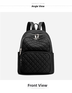 Close-up of black quilted nylon backpack featuring double front pockets and silver zippers