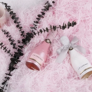 J.P. Chenet mini sparkling wine bottles in pink and white with festive paper shreds