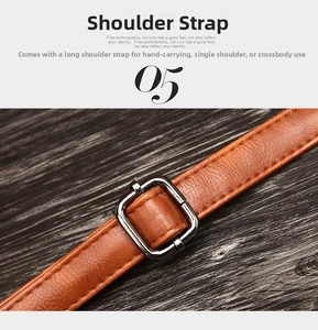 Detail of orange-brown pebble leather shoulder strap with dark gunmetal polished buckle